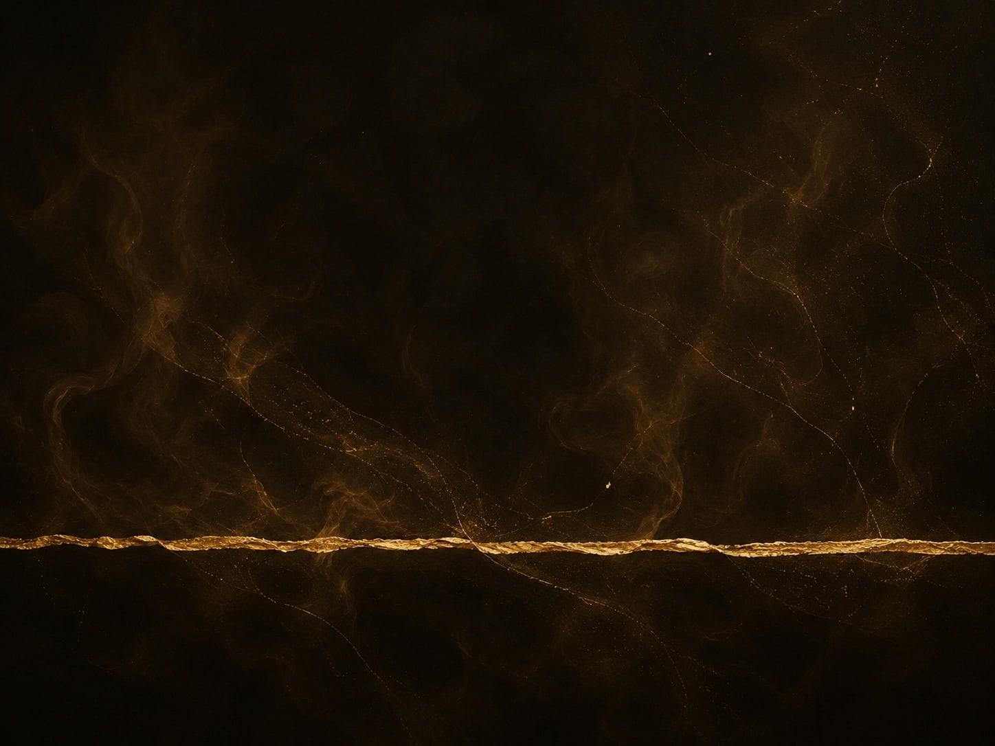 A single thin gold filament stretches across the lower part of a dark hazy field.