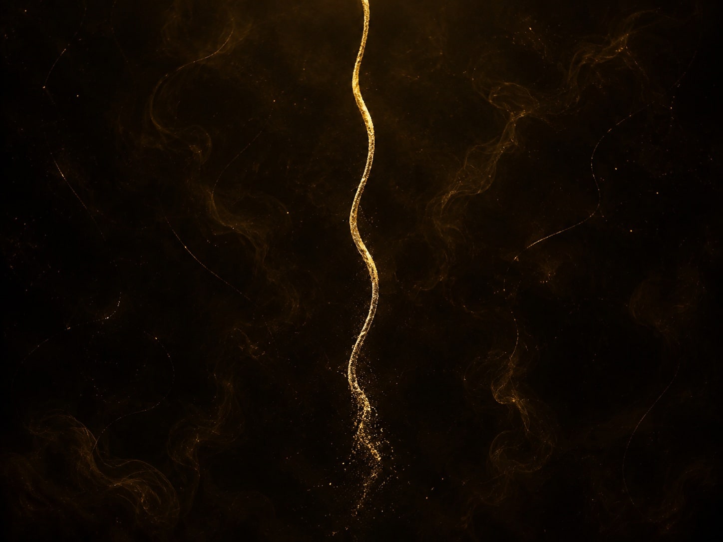 A long wavy gold thread descending from above and dissolving into fine particles against warm dark haze.