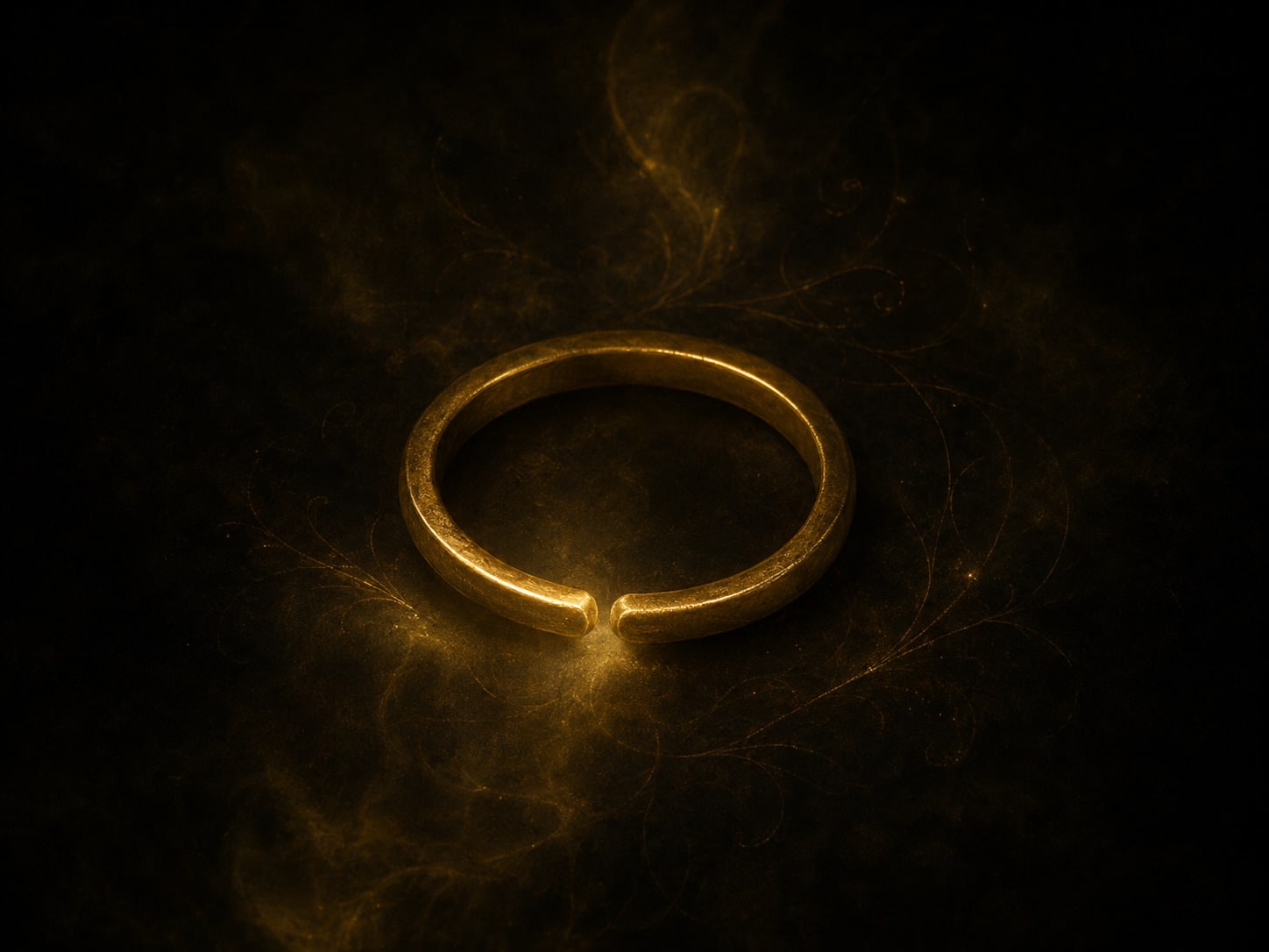 A single gold ring alone in darkness, parted open at one point with a fine thread drawing out through the gap.