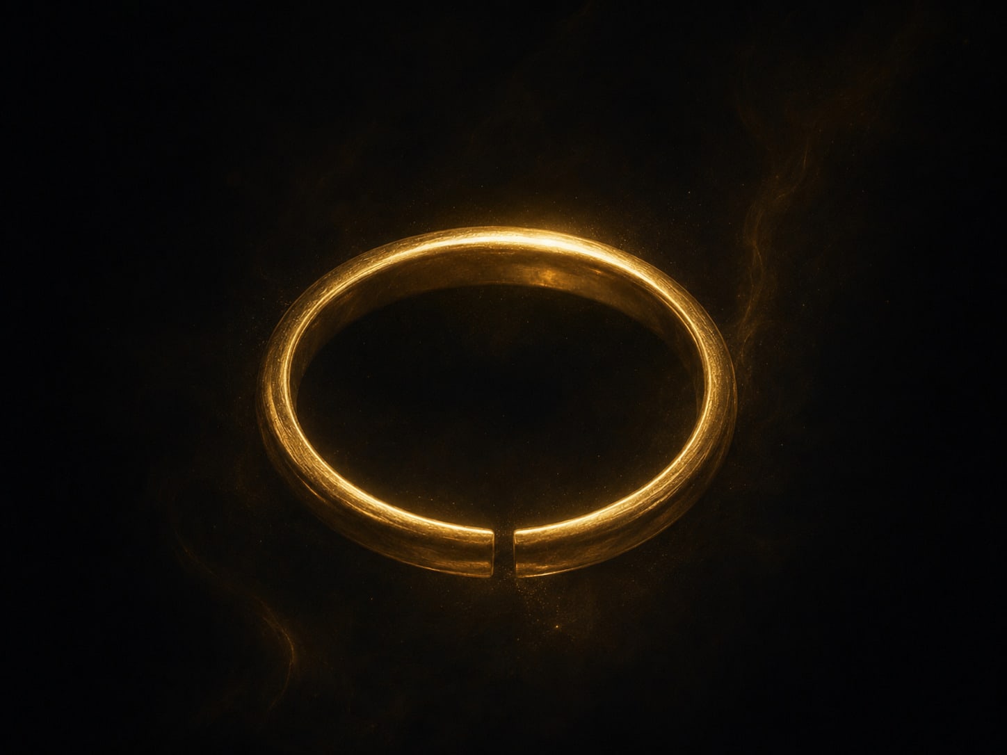 A plain gold band floating in darkness with a narrow hairline break through its shank.